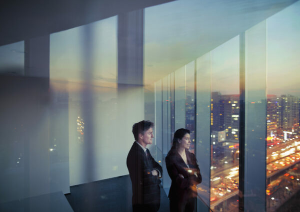 Adult Hispanic woman Caucasian man CEO executive team businessman businesswoman business people in conference meeting room in contemporary modern office daylight sunset dusk talking planning thinking strategy well dressed suit diversity multi-ethnic problems solutions unity cityscape downtown urban new beginnings breaking new ground decisions choices the way forward  contemplation vision focus choices decisions solitude quiet alone