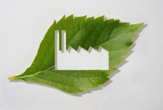 green leaf with a cutout factory symbol green leaf with a cutout factory symbol